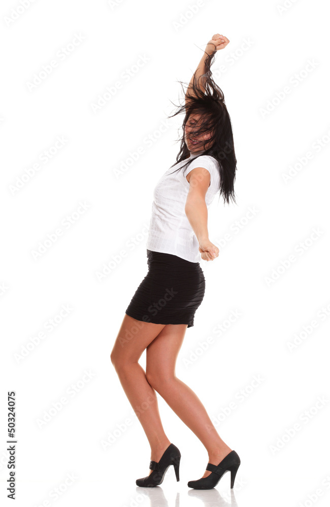 A joyous young female business executive celebrating success rai