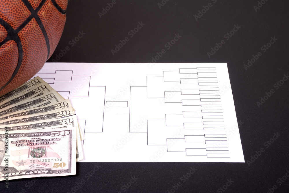 Fototapeta premium March Madness Bracket Basketball and Fanned Money on Black