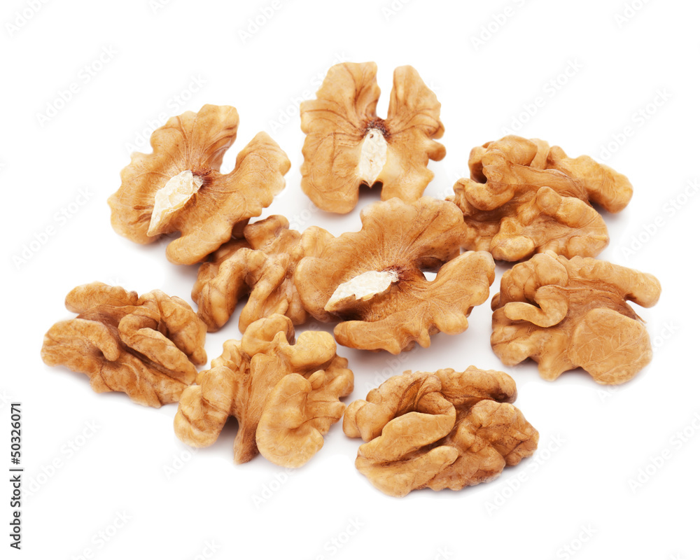 Heap of fresh shelled walnuts on white background. Close-up. Heap of fresh shelled walnuts on white background. Close-up.