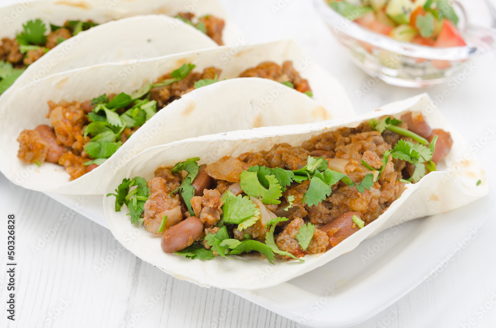 chili con carne in wheat tortillas closeup chili con carne in wheat tortillas closeup