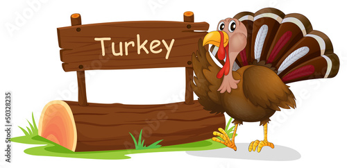 A wooden signage with a turkey