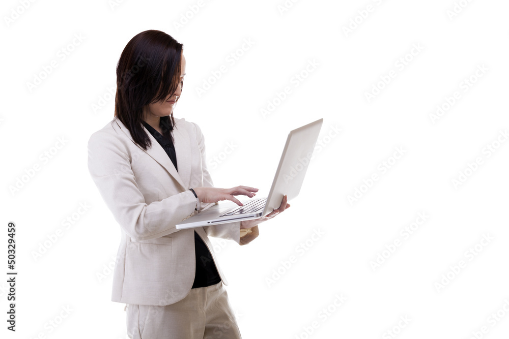 Working businesswoman at a notebook isolated over white backgrou Working businesswoman at a notebook isolated over white backgrou