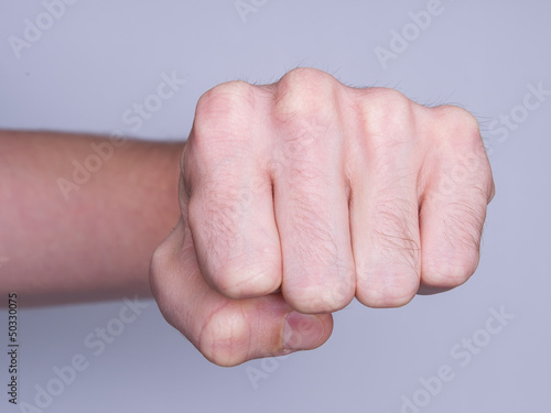 Fist of a man punching