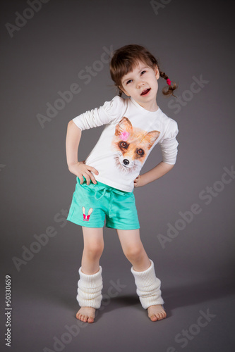 little girl on gray background