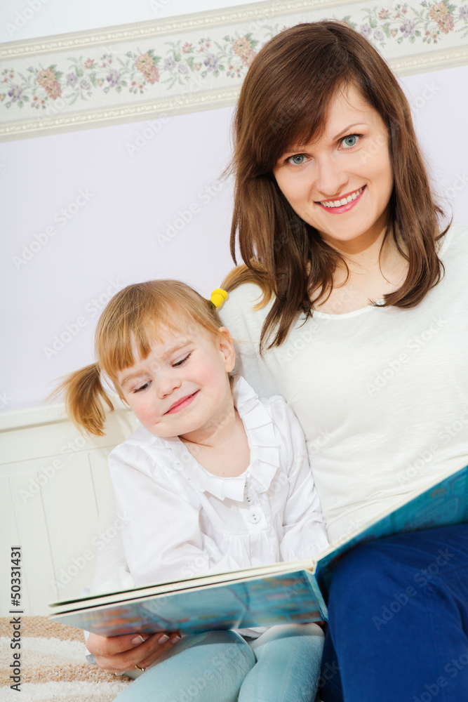 Mother with child reading book Mother with child reading book