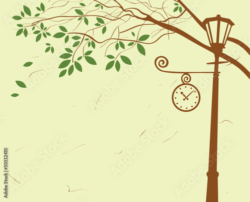 city ​​park with lantern and clock under a tree