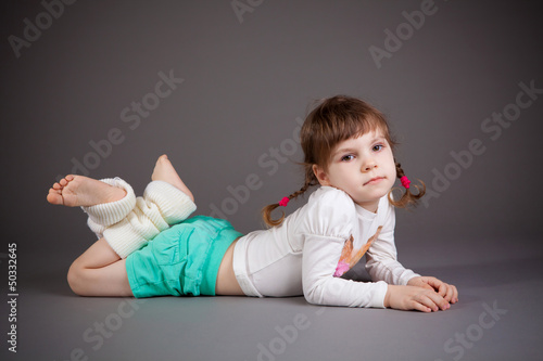 little girl on gray background