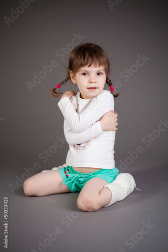 little girl on gray background