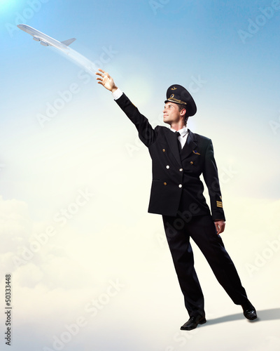 Image of pilot touching air photo