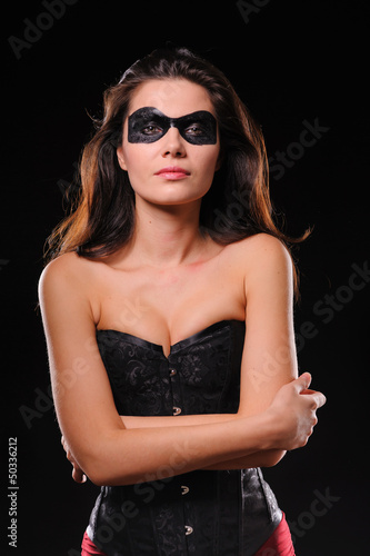 woman in corset and black mask