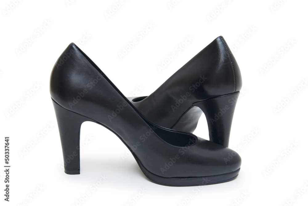 Close-up of female high-heeled shoes over white background Close-up of female high-heeled shoes over white background