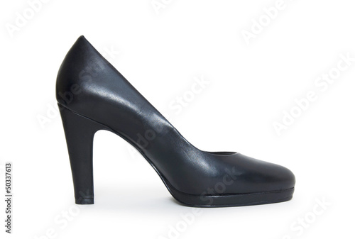 Close-up of female high-heeled shoes over white background