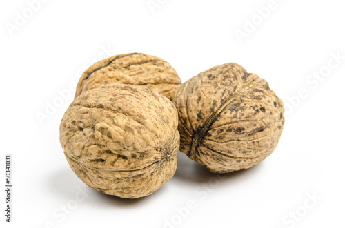 dried walnuts on white background