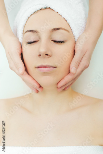 Close-up of a female receiving facial massage