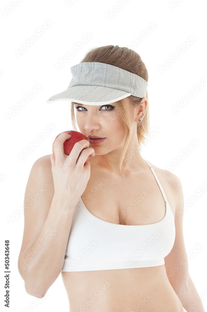 Beautiful  seductive  female tennis player with red apple.