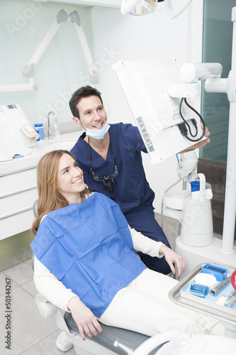 Dentist and patient looking at the monitor