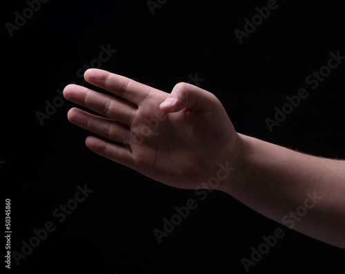 Four fingers on a black background
