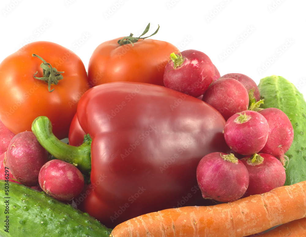 Assorted appetizing vegetables isolated over white closeup Assorted appetizing vegetables isolated over white closeup