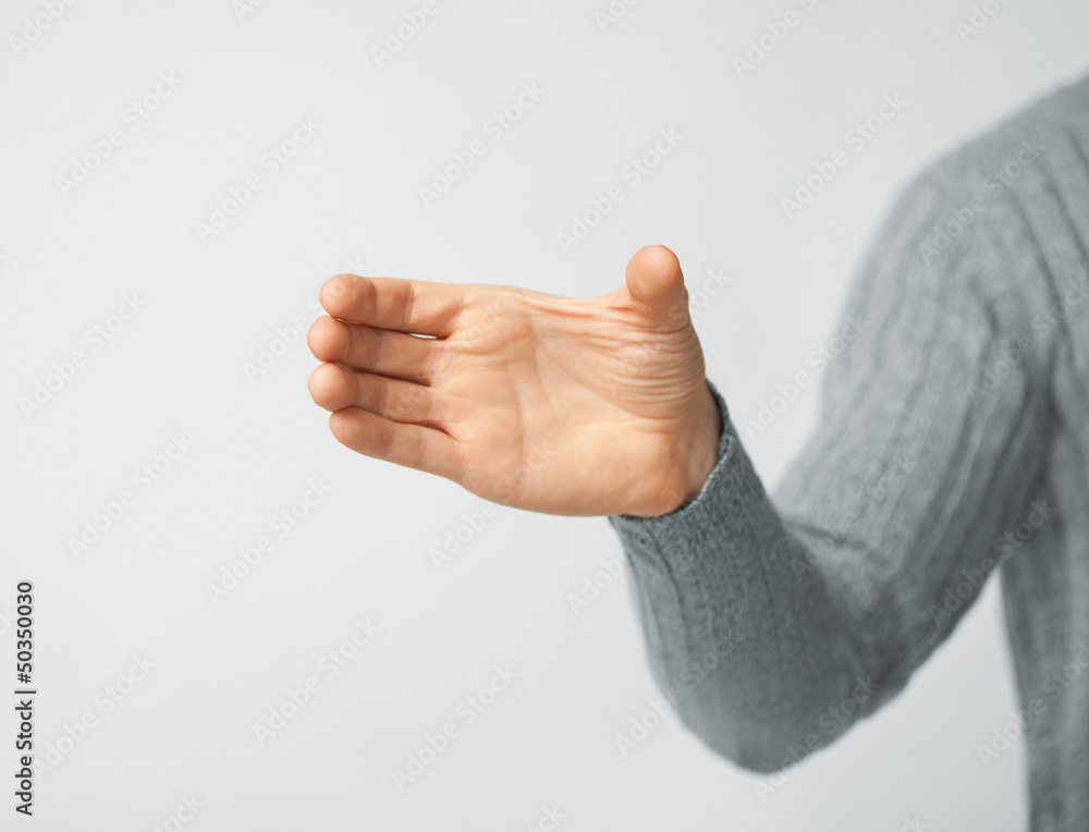 Фотография man holding imaginary object
