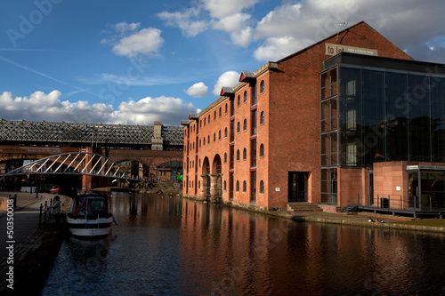 View at the red brick buildings and canals in Castlefield, Manchester, England, United Kingdom photo