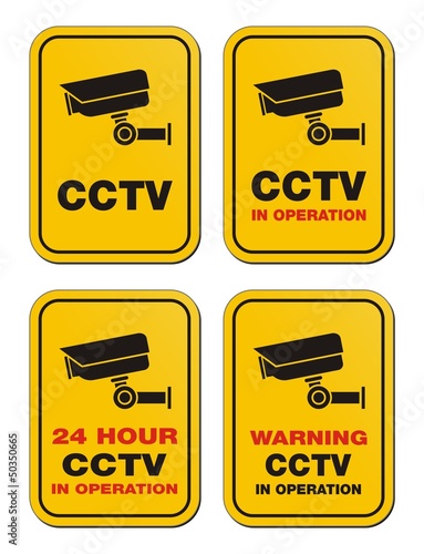 24 hour CCTV in operation - yellow signs