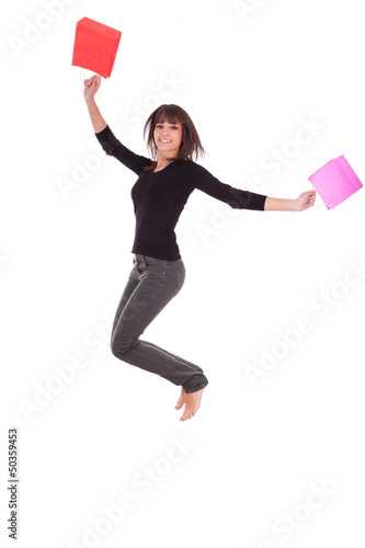 Happy caucasian woman jumping with shopping bags