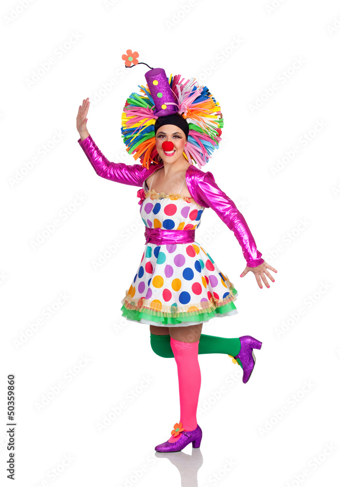Funny girl clown with a big colorful wig dancing Funny girl clown with a big colorful wig dancing