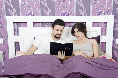 Reading a book about sex problems.