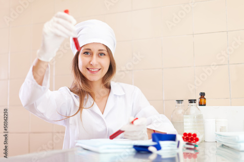 Positive  nurse with test tube photo