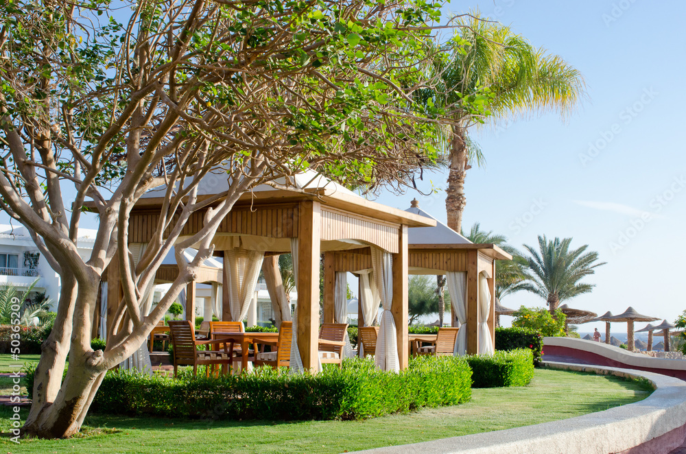 Luxury beach gazebo with white canopy in garden