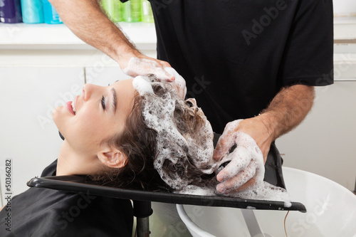 Client Getting Hair Washed By Hairstylist