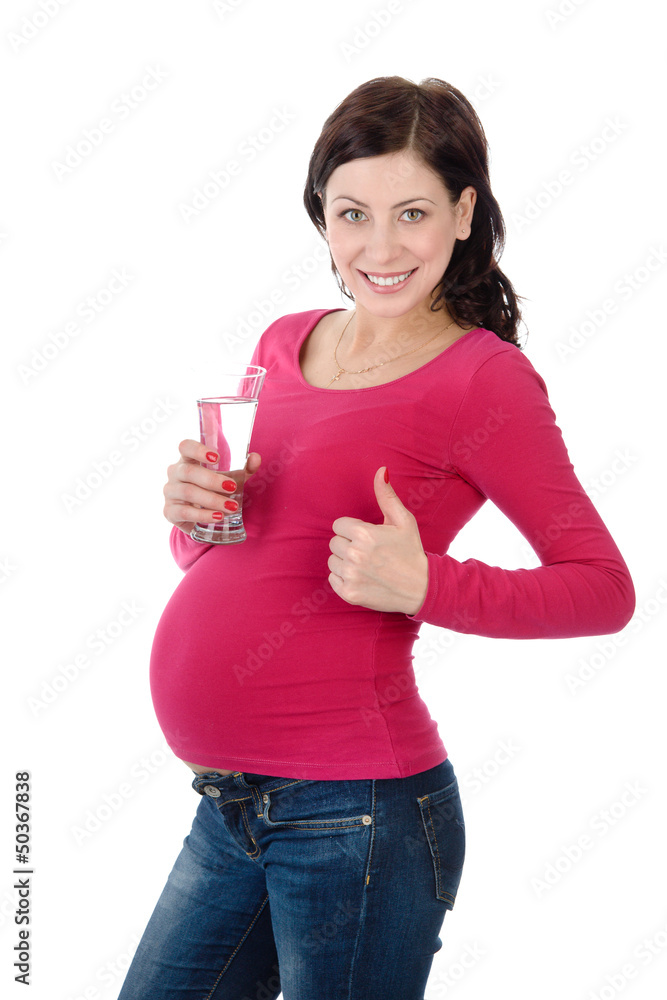 Portrait of a lovely pregnant woman drinking water. isolated