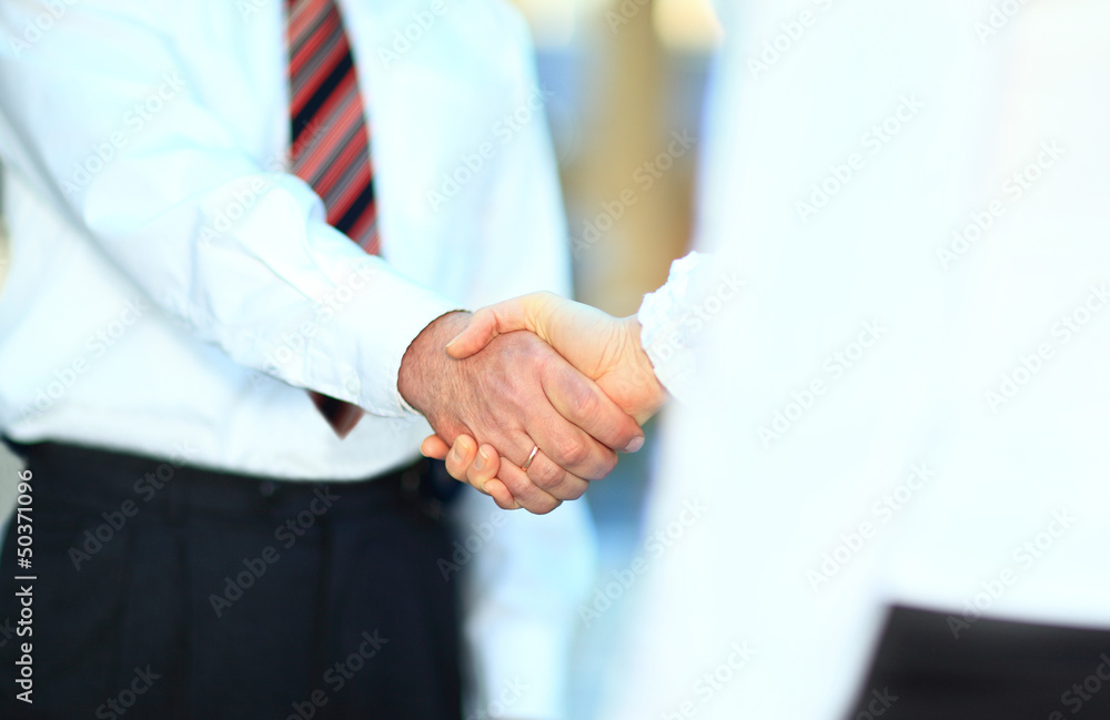 © yurolaitsalbert - handshake isolated on business background © yurolaitsalbert - handshake isolated on business background