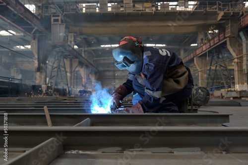 welder with protective equipment