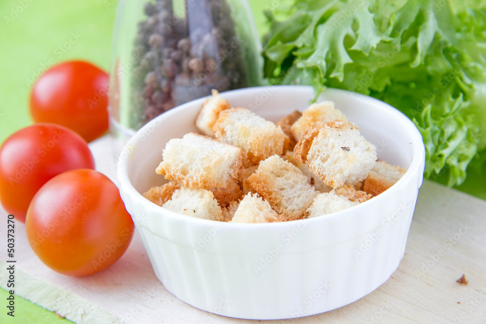 Crouton in white ceramic cup