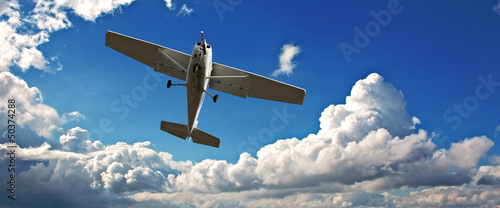 Canvas Print Small light aircraft on training flight