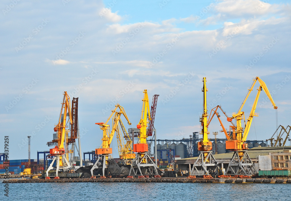 Cargo crane, freight traine and coal in port