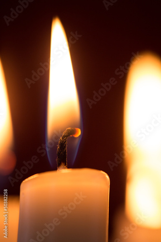 Close up of lit candle photo