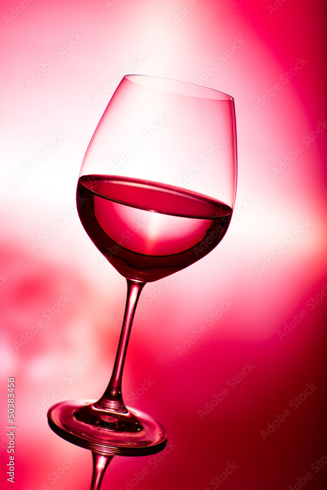 glass of wine on red glass of wine on red