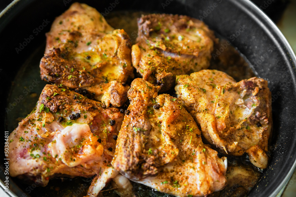 Chicken on frying pan