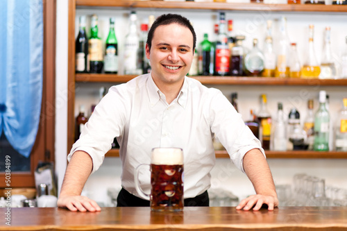 Bartender offering you a beer