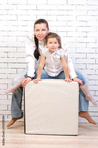 Mom and daughter in jeans, white shirt