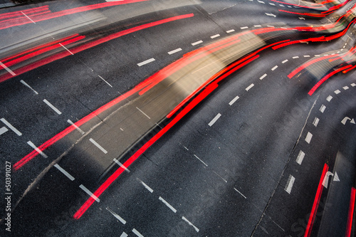 Motion blurred city road traffic (color toned  image) © lightpoet