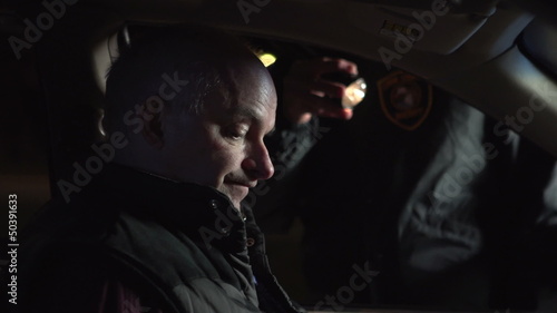 Man gets pulled over by police officer and is questioned