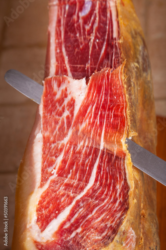 Slicing Spanish jamon iberico (ham)