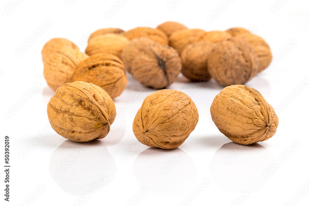 Walnuts close up over white background Walnuts close up over white background