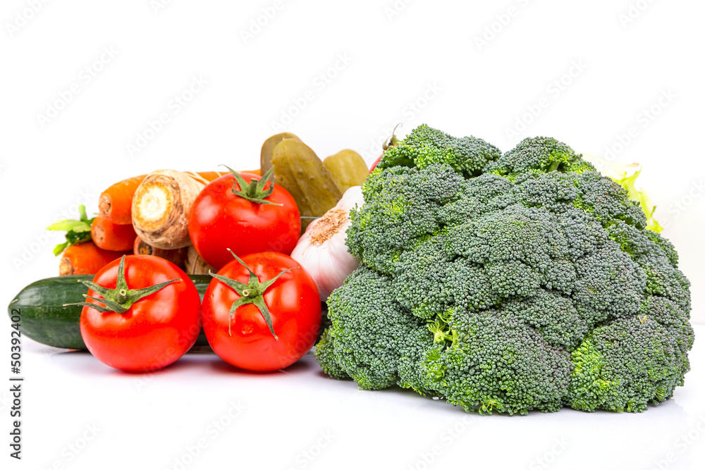 Composition with raw vegetables isolated on white Composition with raw vegetables isolated on white