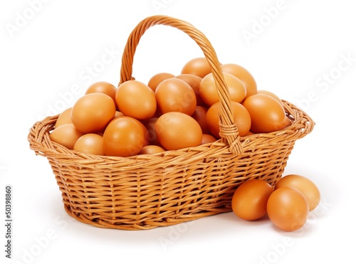 Brown chicken eggs in basket