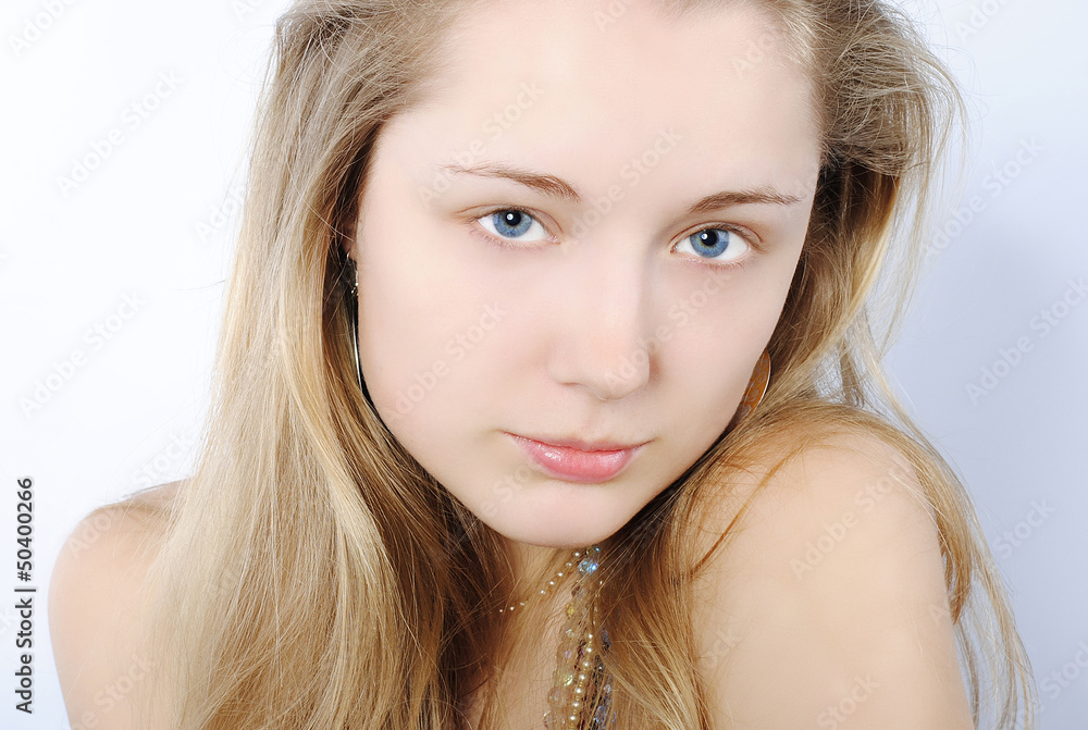 Portrait of the beautiful girl in costume jewellery Portrait of the beautiful girl in costume jewellery