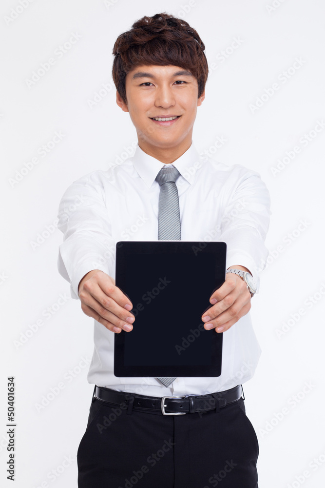 Young Asian business man showing a pad PC Young Asian business man showing a pad PC